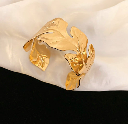Gold leaf-shaped cuff bracelet for a fashion loving woman and girl