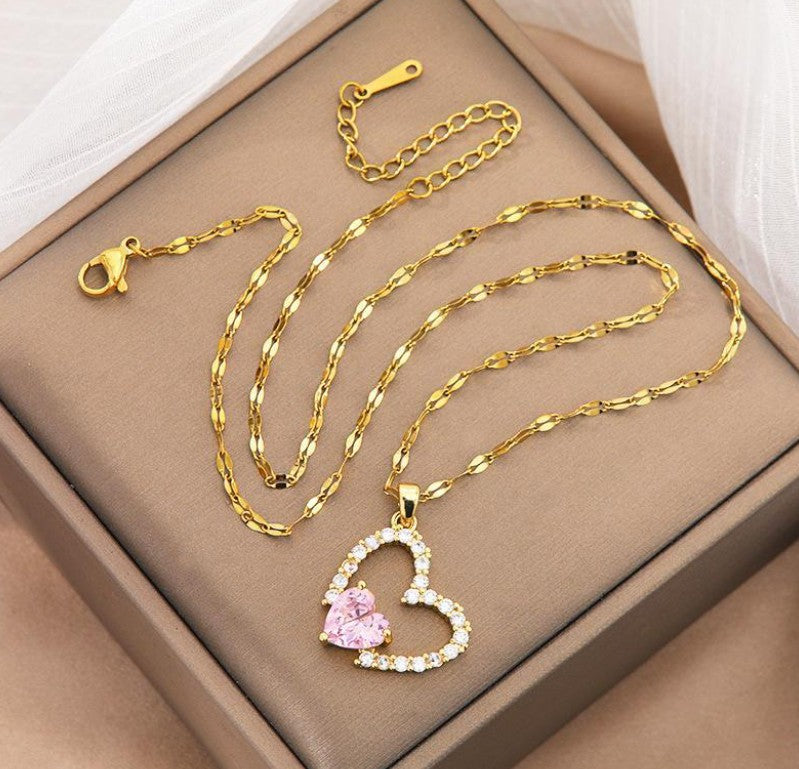 Gold necklace with a heart-shaped pendant